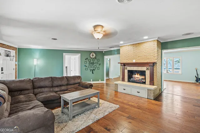 a bedroom with a large bed and a dresser