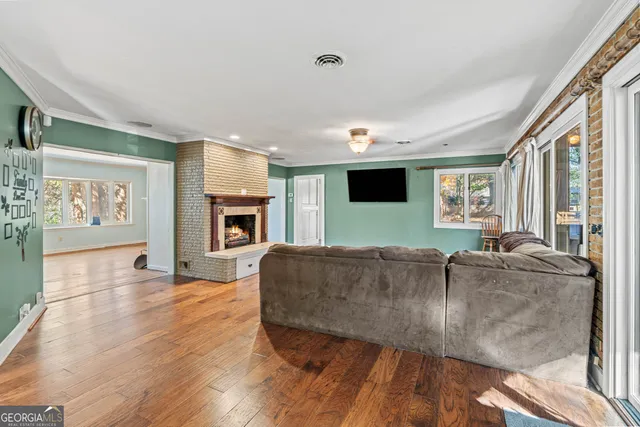 a spacious bedroom with a bed and ceiling fan