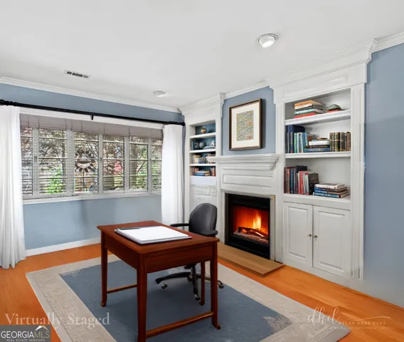 a room with a dresser and a window