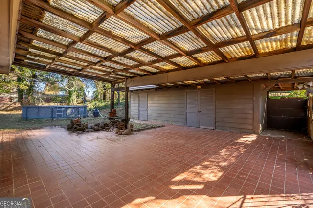 a view of a house with a yard and tree