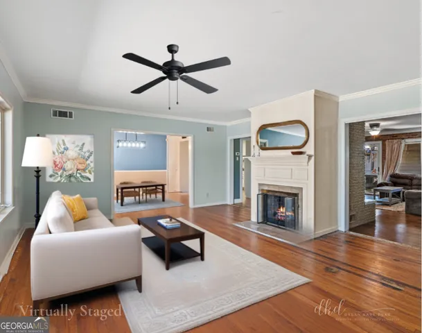 a view of a room with wooden floor water heater and a window