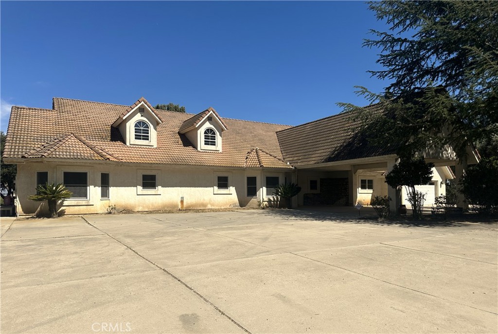 26050 Jan Valerie Road Murrieta, CA 92562 - Photo 1 of 47 a view of a white house with a large windows