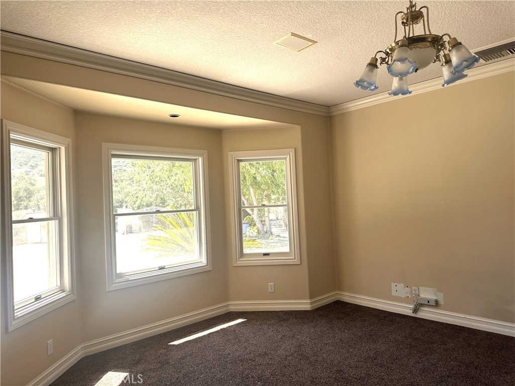 26050 Jan Valerie Road Murrieta, CA 92562 - Photo 22 of 47 an empty room with windows