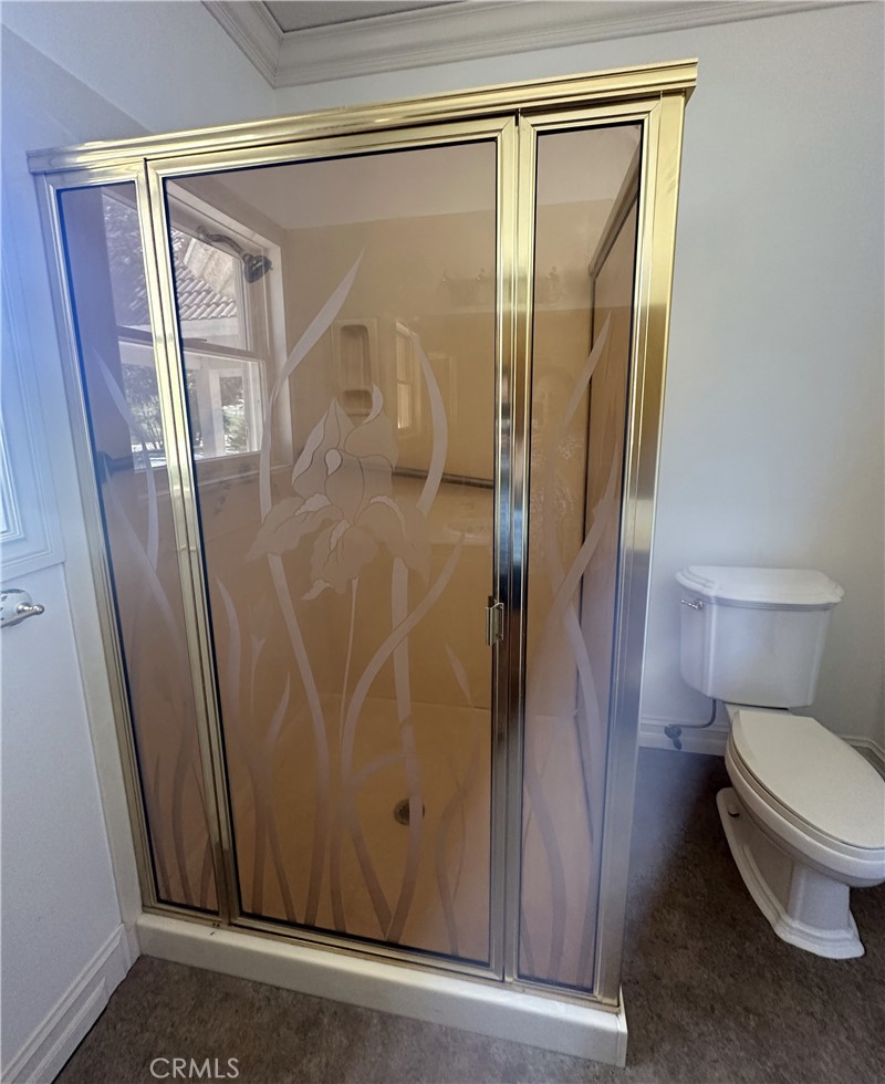 26050 Jan Valerie Road Murrieta, CA 92562 - Photo 26 of 47 a bathroom with a granite countertop shower and a toilet