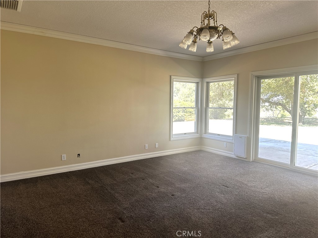26050 Jan Valerie Road Murrieta, CA 92562 - Photo 28 of 47 an empty room with windows and outdoor view