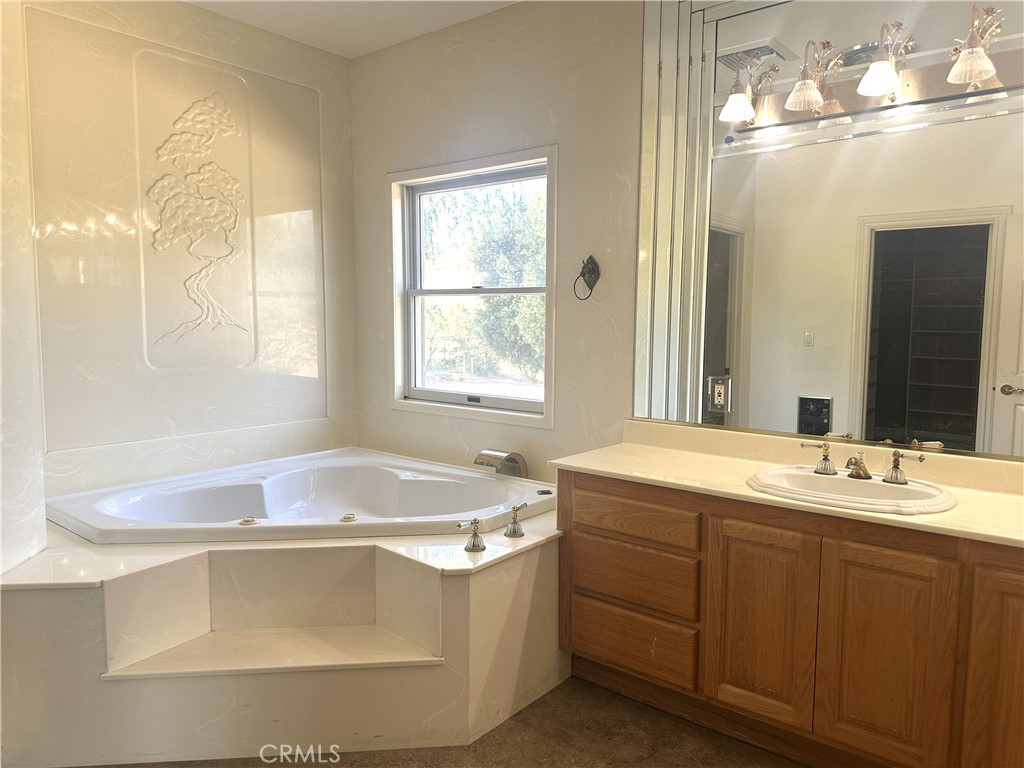26050 Jan Valerie Road Murrieta, CA 92562 - Photo 29 of 47 a bath tub sitting in a bathroom next to a window