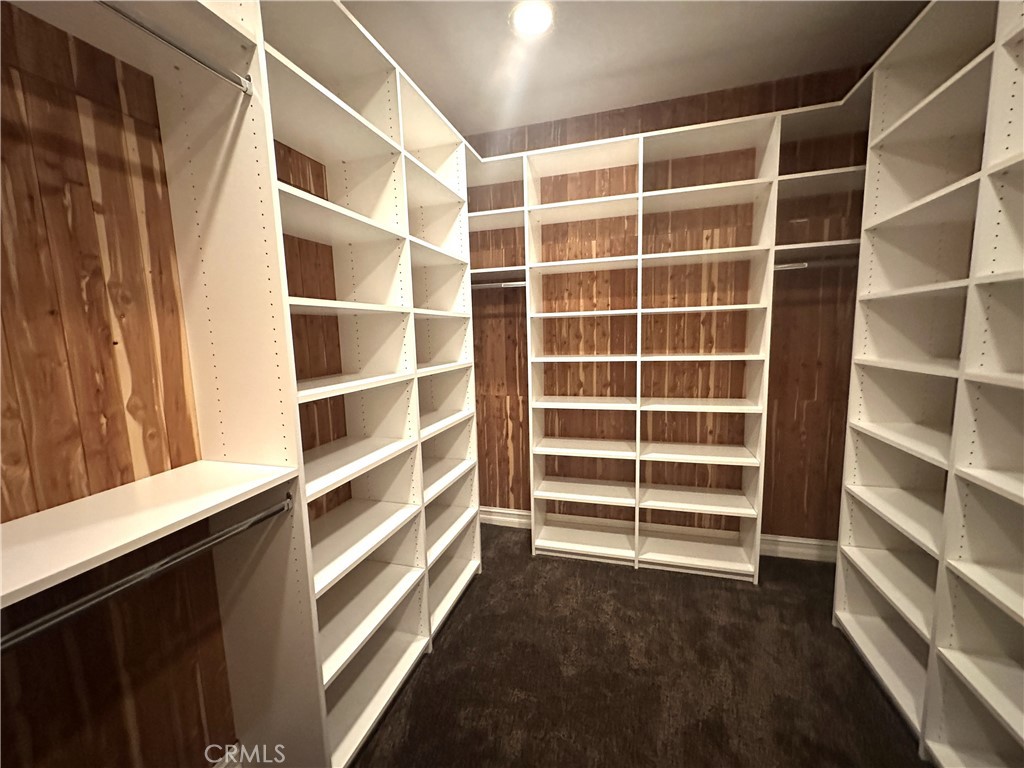26050 Jan Valerie Road Murrieta, CA 92562 - Photo 32 of 47 a view of walk in closet with empty racks