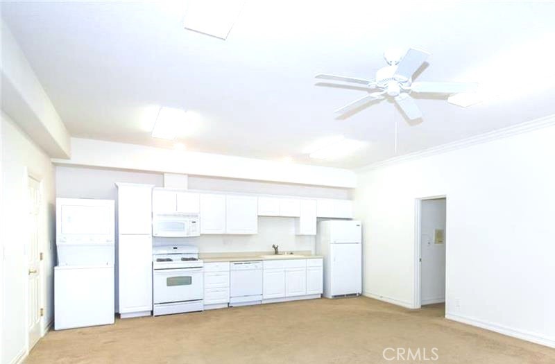 26050 Jan Valerie Road Murrieta, CA 92562 - Photo 40 of 47 a kitchen with a cabinets and white appliances