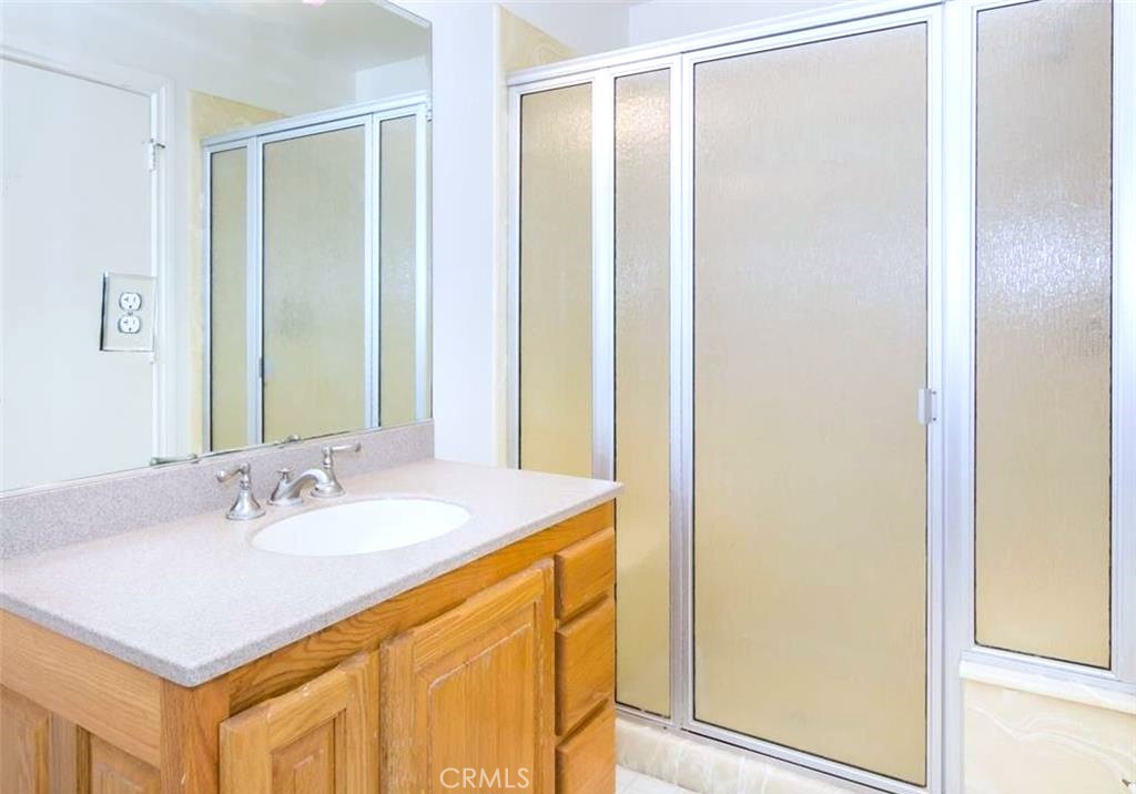 26050 Jan Valerie Road Murrieta, CA 92562 - Photo 43 of 47 a bathroom with a sink and a mirror