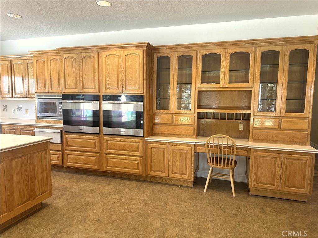 26050 Jan Valerie Road Murrieta, CA 92562 - Photo 5 of 47 a kitchen with a table and chairs