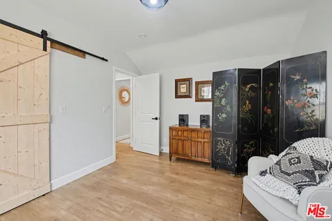 a bedroom with furniture and window