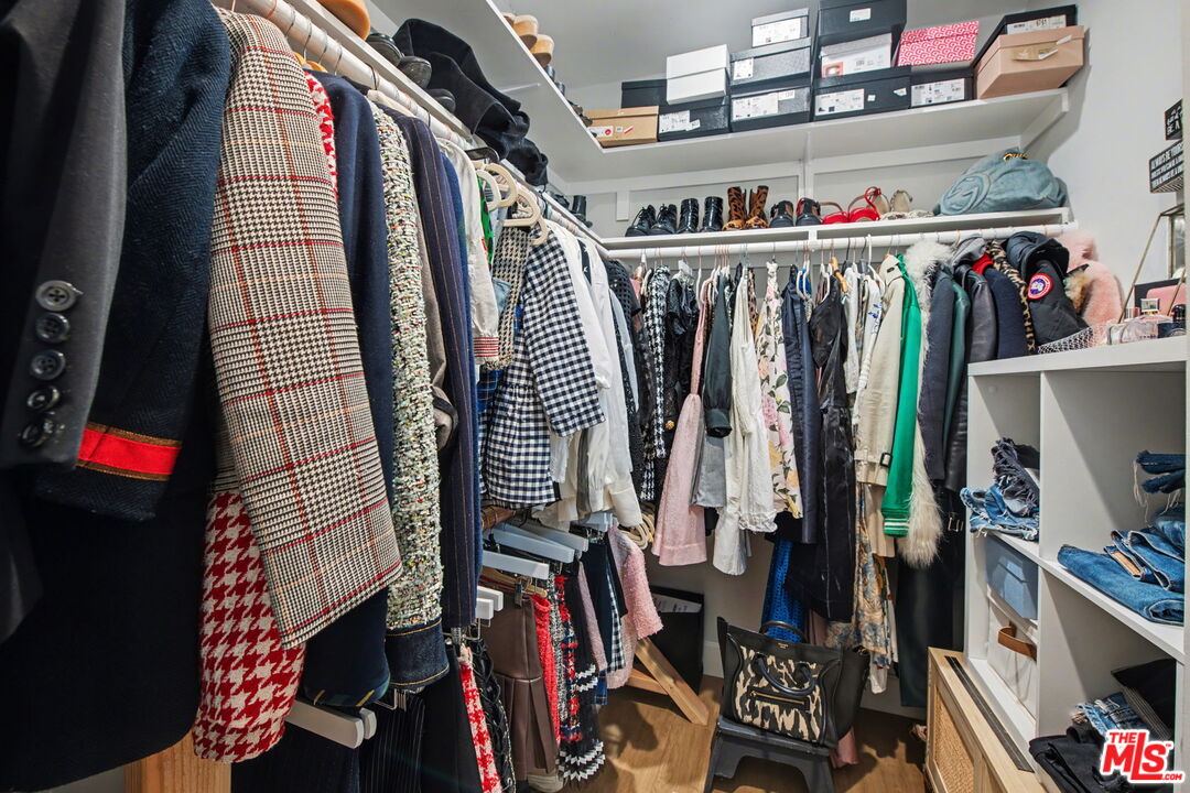 1135 West 81st Place Los Angeles, CA 90044 - Photo 19 of 23 a view of walk in closet with clothes