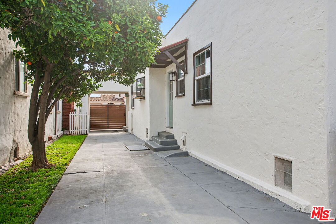 1135 West 81st Place Los Angeles, CA 90044 - Photo 23 of 23 a view of a house with a yard