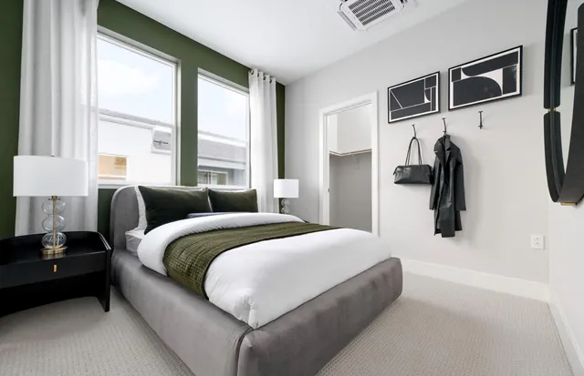 a bedroom with a bed and a walk in closet