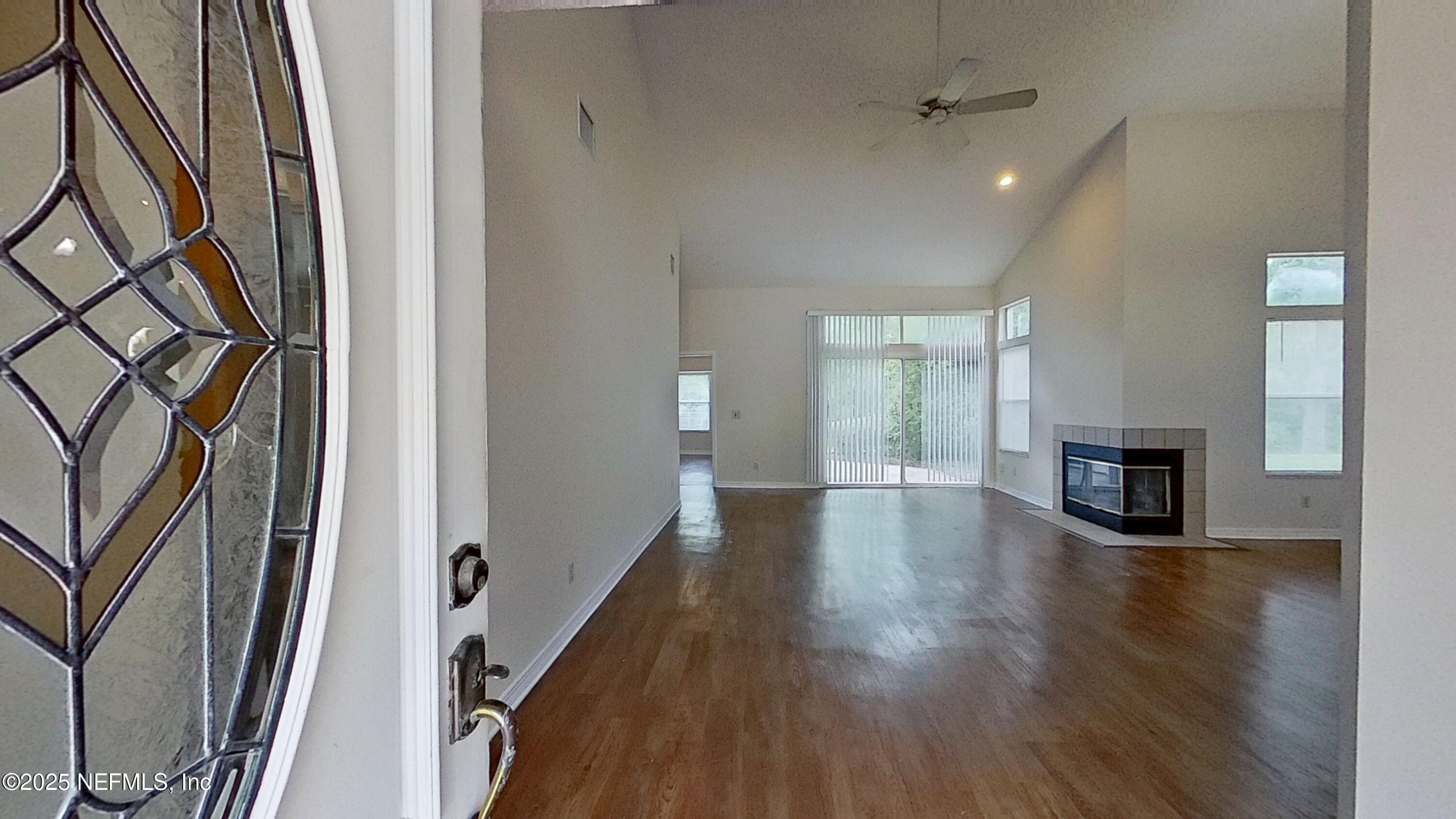 1488 Marsh Rabbit Way Fleming Island, FL 32003 - Photo 18 of 35 wooden floor in an empty room with a window