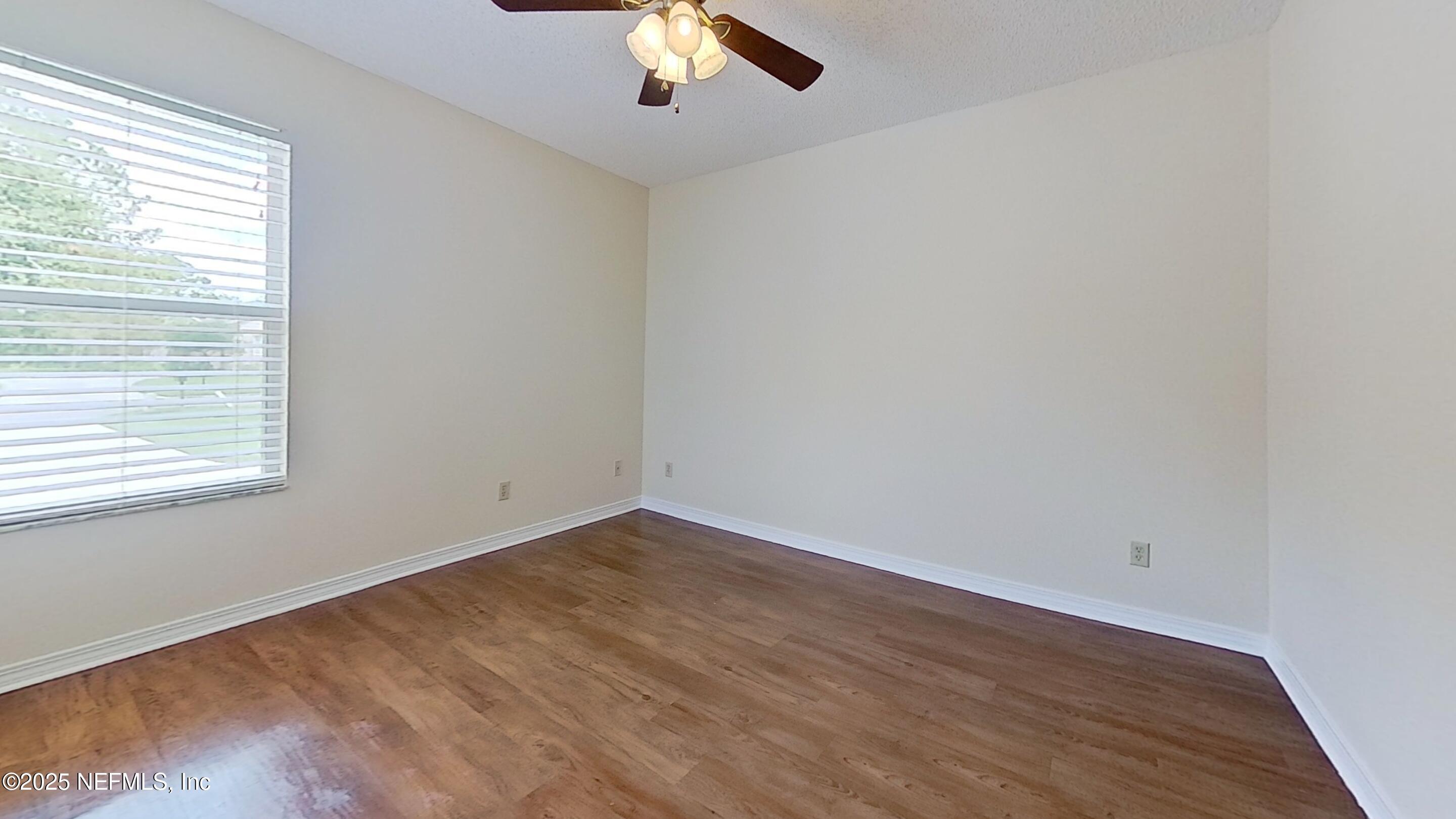 1488 Marsh Rabbit Way Fleming Island, FL 32003 - Photo 24 of 35 an empty room with a window