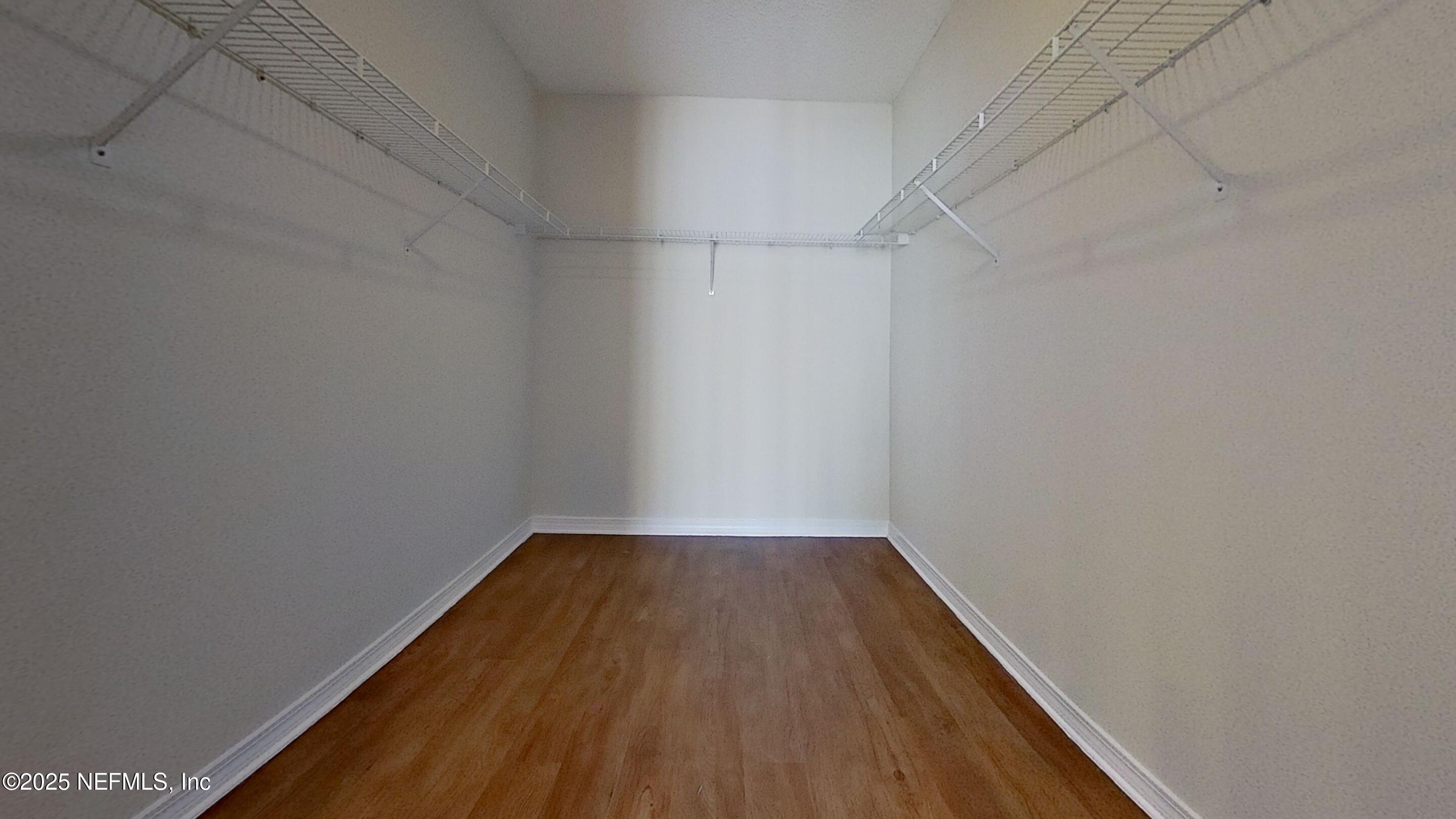 1488 Marsh Rabbit Way Fleming Island, FL 32003 - Photo 25 of 35 a view of a room with wooden floor