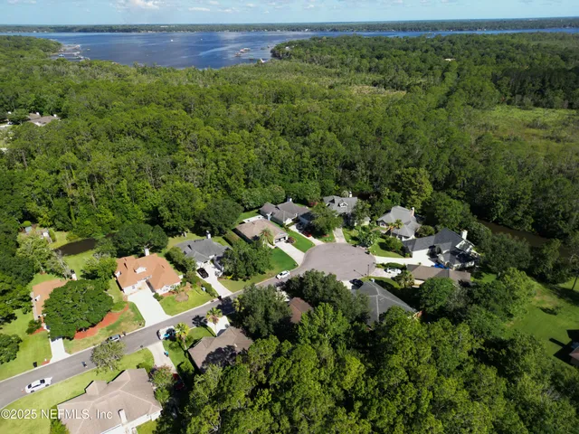 an aerial view of multiple house with yard