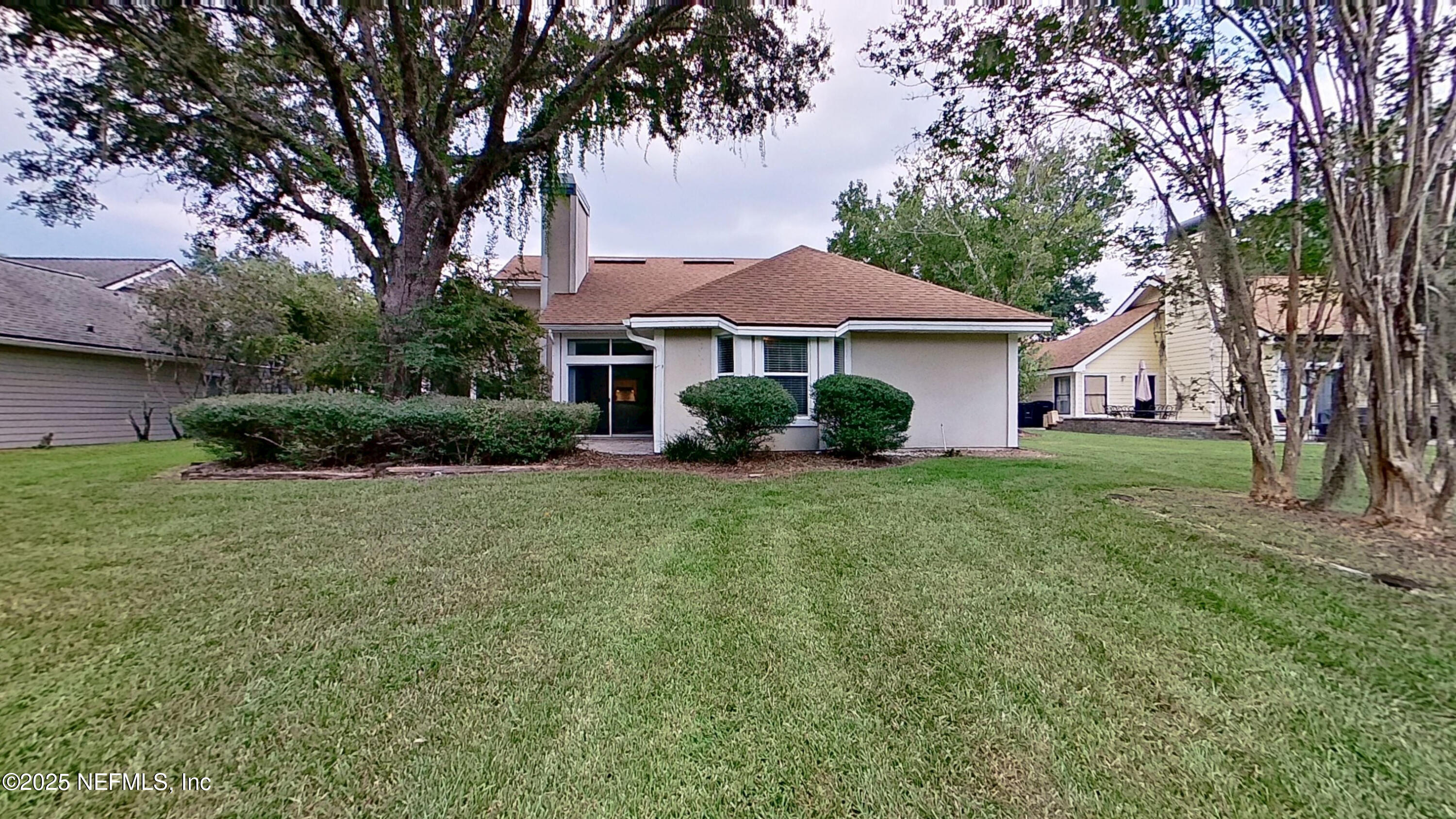 1488 Marsh Rabbit Way Fleming Island, FL 32003 - Photo 6 of 35 a front view of a house with garden