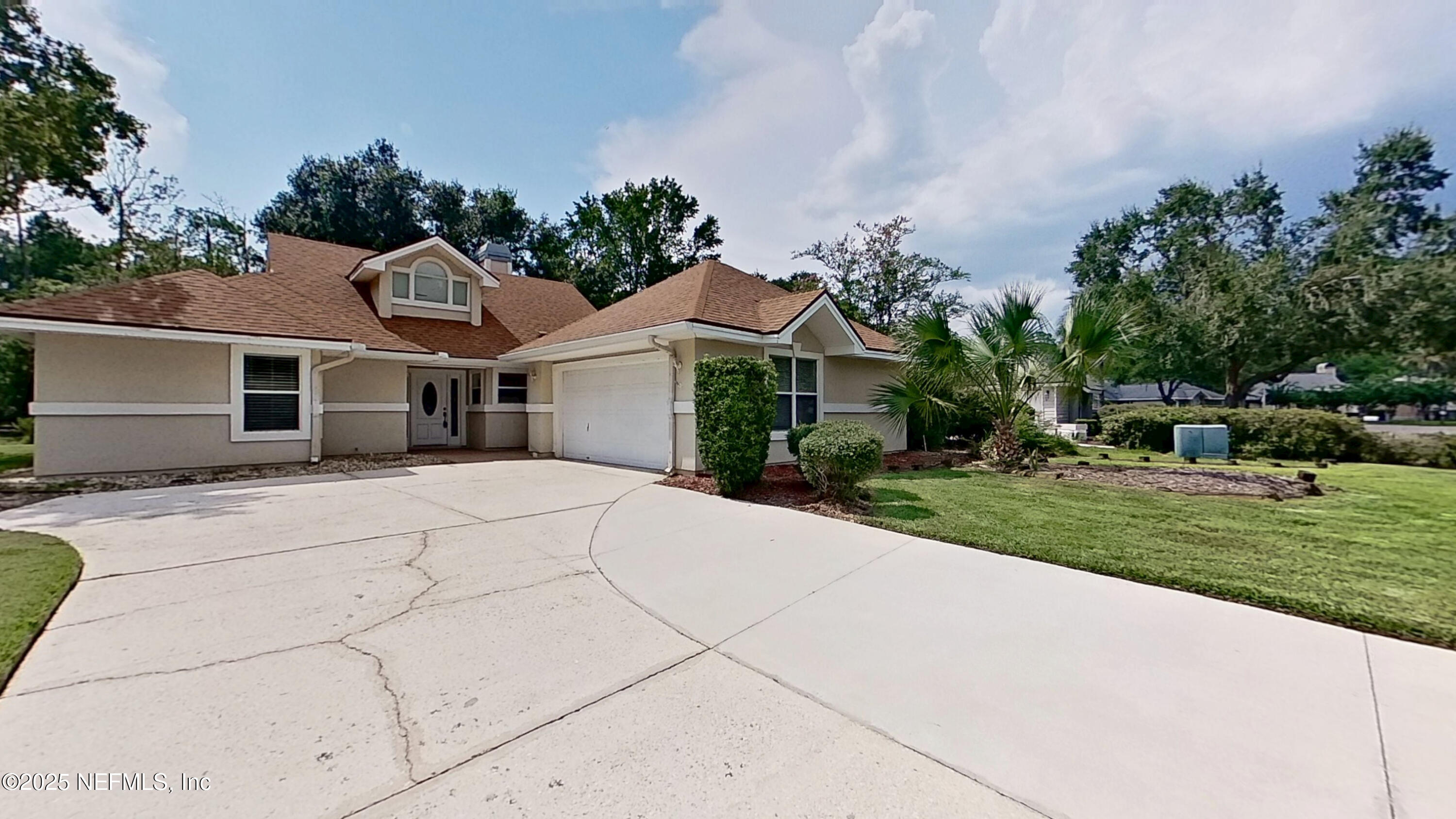 1488 Marsh Rabbit Way Fleming Island, FL 32003 - Photo 7 of 35 a front view of a house with a yard and potted plants