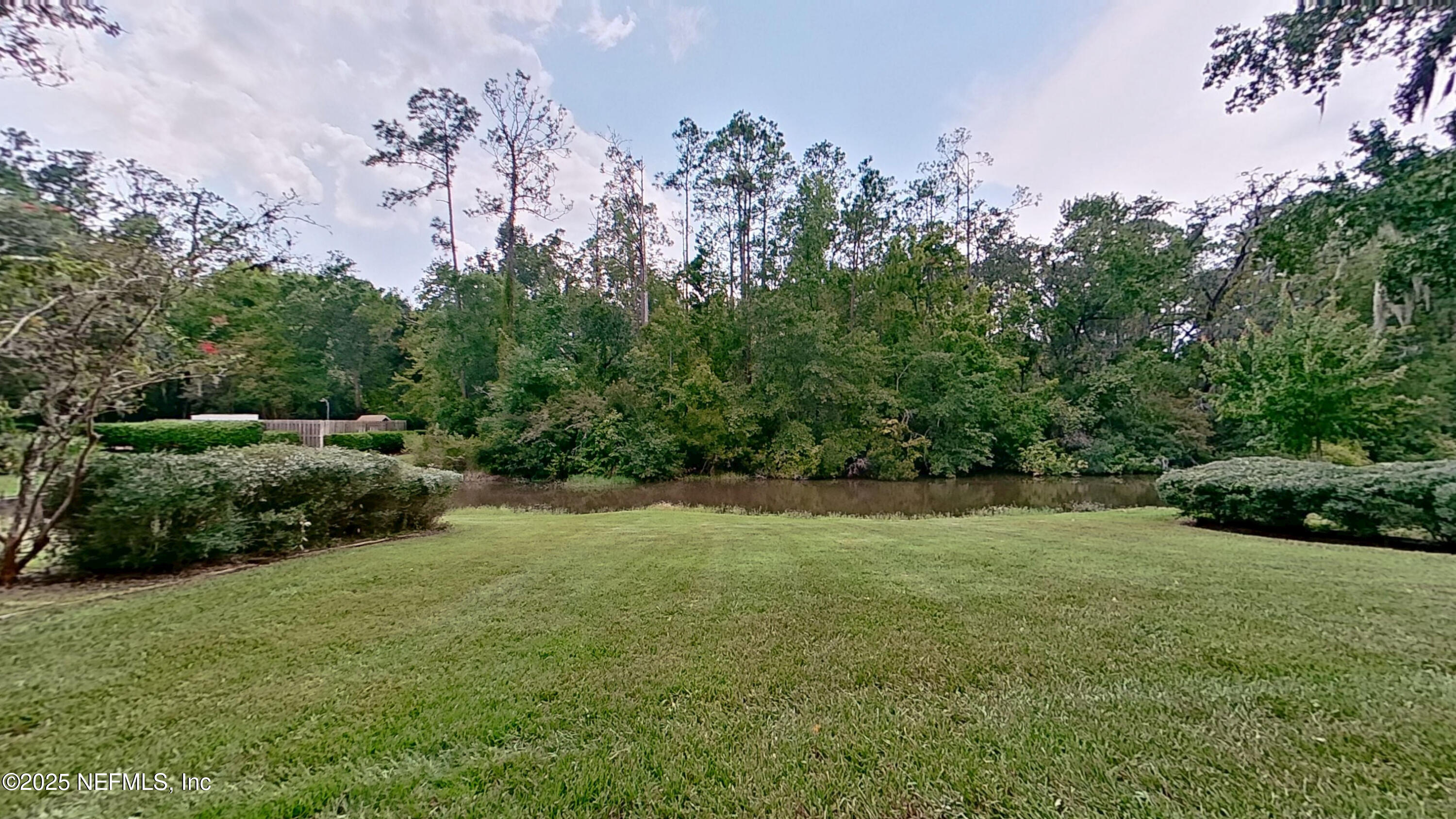 1488 Marsh Rabbit Way Fleming Island, FL 32003 - Photo 10 of 35 a view of an outdoor space and a yard