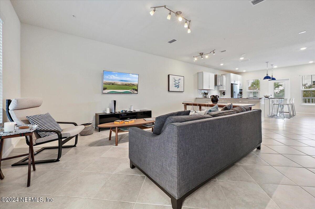 103 Spring Tide Way Ponte Vedra, FL 32081 - Photo 11 of 26 a living room with furniture and a flat screen tv