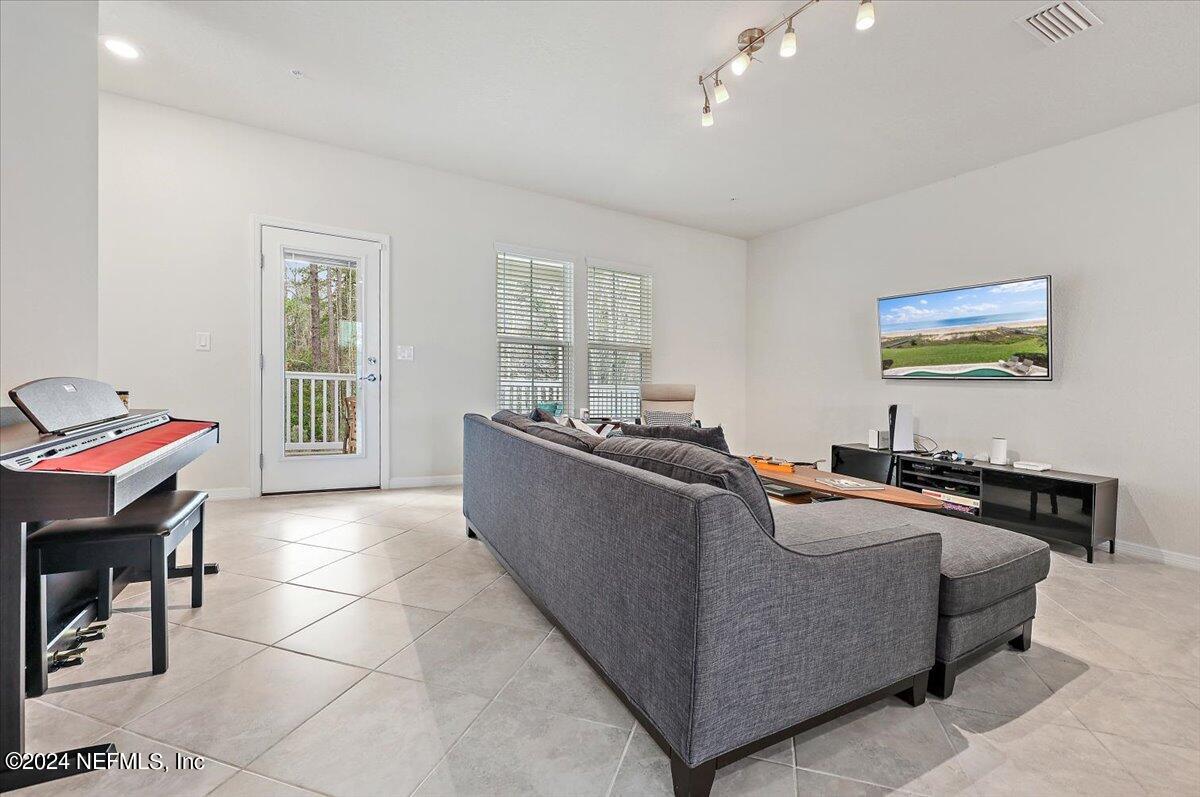 103 Spring Tide Way Ponte Vedra, FL 32081 - Photo 12 of 26 a living room with furniture and painting on the wall