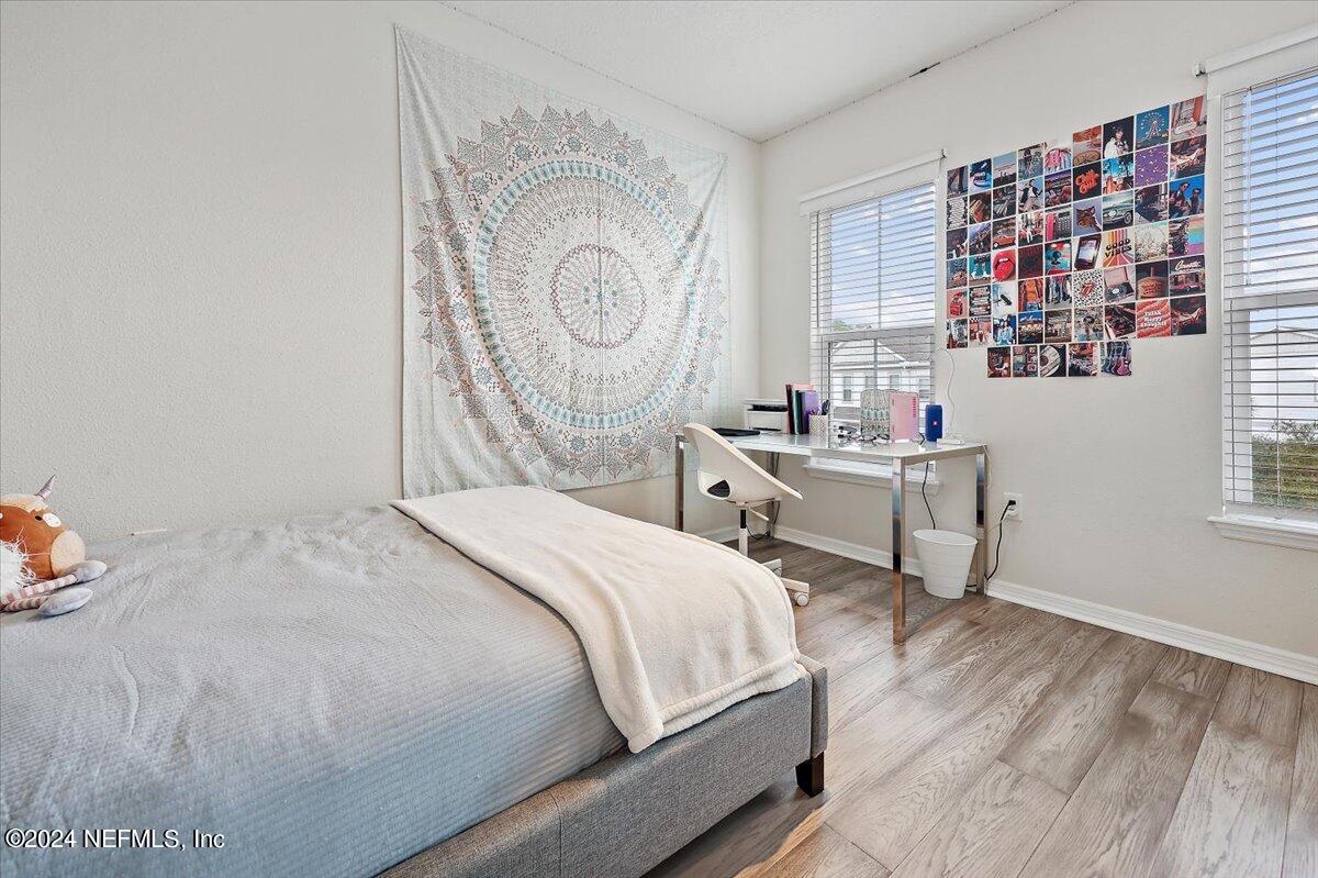 103 Spring Tide Way Ponte Vedra, FL 32081 - Photo 21 of 26 a bedroom with a bed and a window