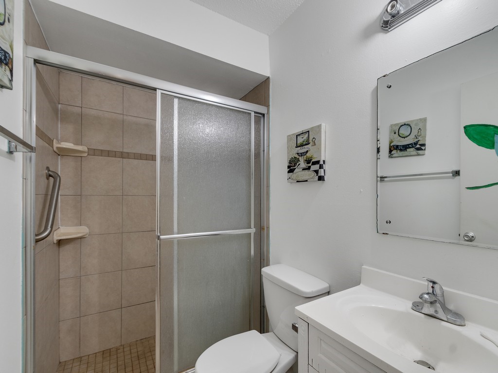 418 Maple Street Sebastian, FL 32958 - Photo 21 of 28 a bathroom with a sink toilet and shower