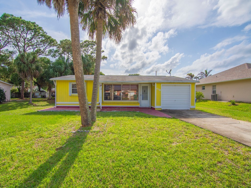 418 Maple Street Sebastian, FL 32958 - Photo 23 of 28 a house with swimming pool in front of it
