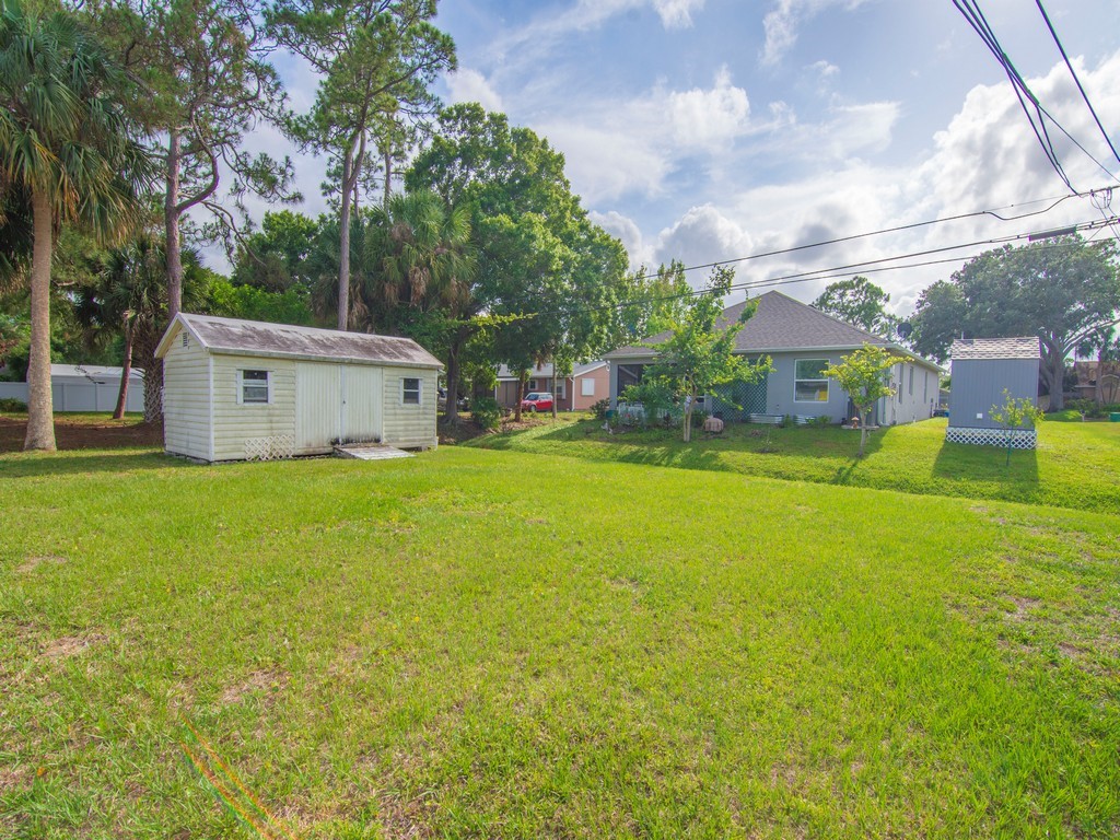 418 Maple Street Sebastian, FL 32958 - Photo 26 of 28 a view of a house with a big yard