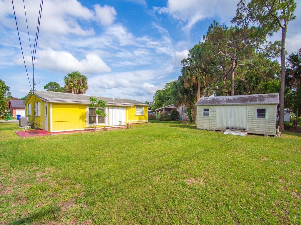 418 Maple Street Sebastian, FL 32958 - Photo 27 of 28 a view of a house with a back yard