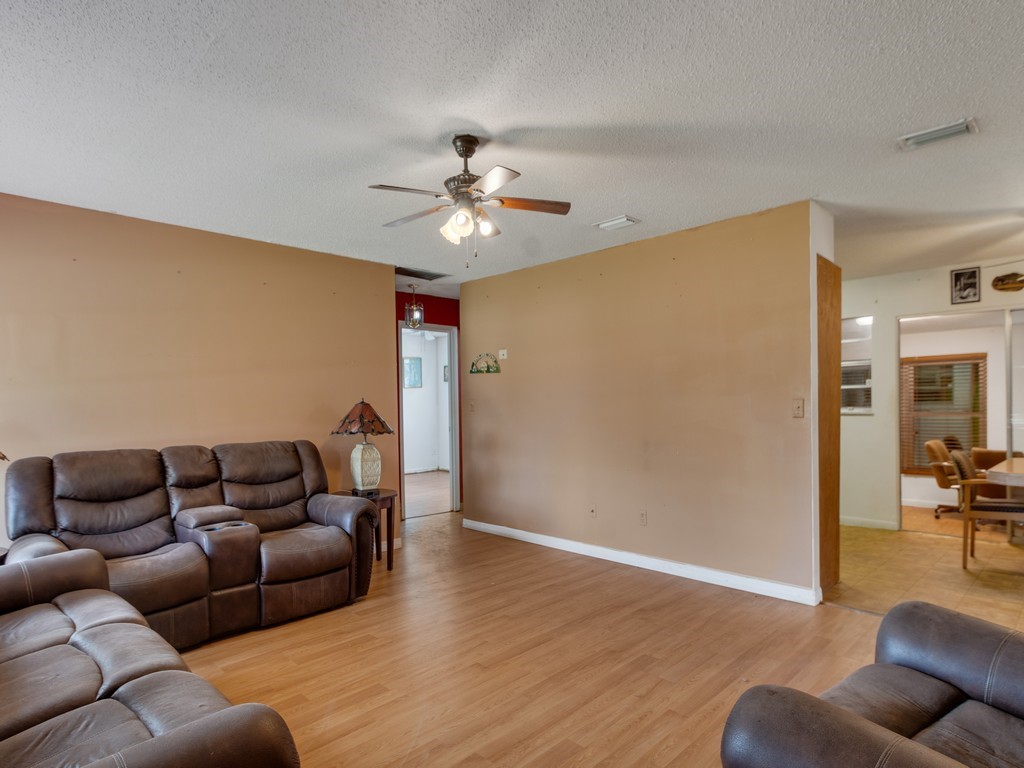418 Maple Street Sebastian, FL 32958 - Photo 6 of 28 a living room with furniture and a couch