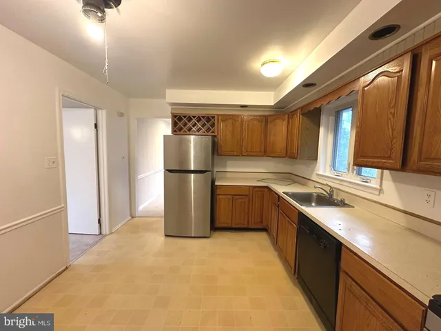 an empty room with fan and fan