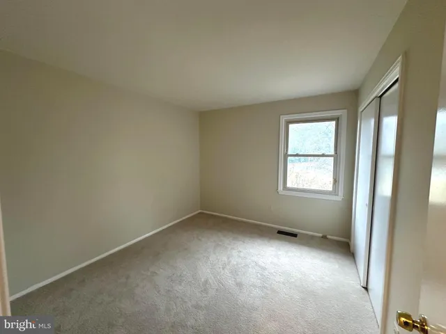 a view of empty room with windows
