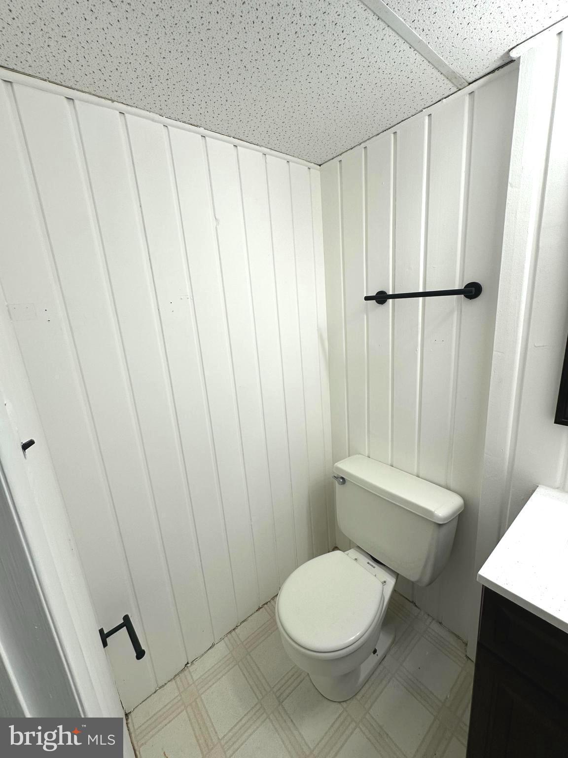 4037 Olney Laytonsville Road Olney, MD 20832 - Photo 32 of 42 a white toilet sitting next to a small sink