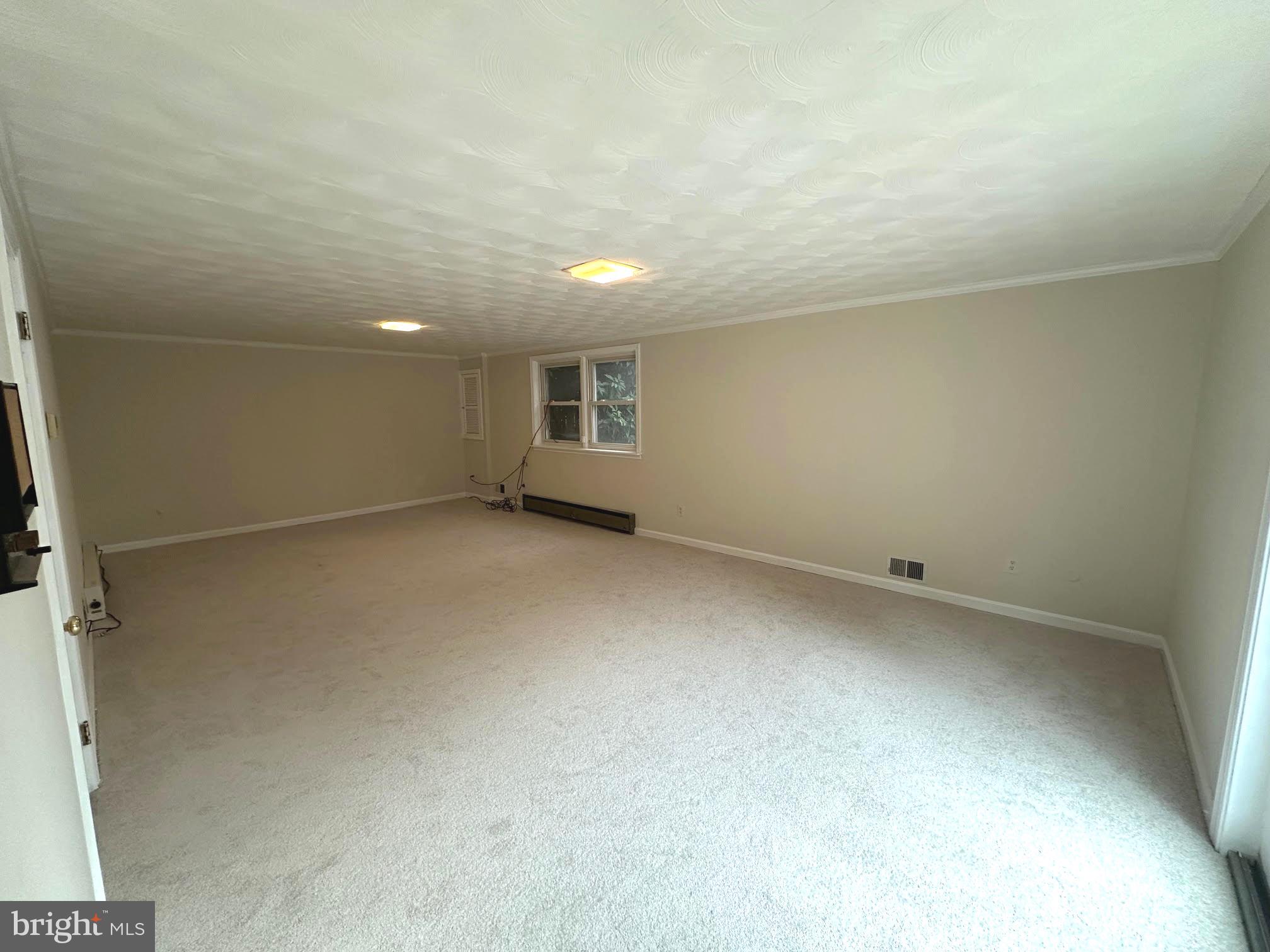 4037 Olney Laytonsville Road Olney, MD 20832 - Photo 34 of 42 an empty room with a empty space and windows