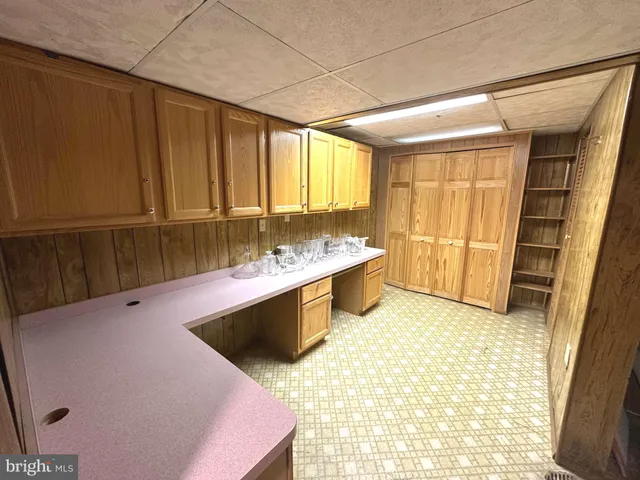 a view of kitchen with furniture and fireplace