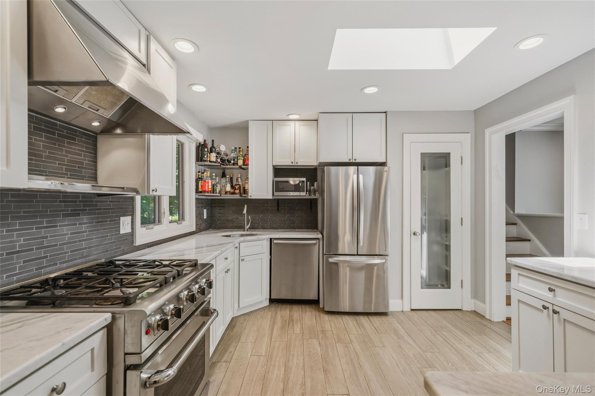 44 Sayer Road Blooming Grove, NY 10914 - Photo 9 of 39 a kitchen with a stove a refrigerator and a sink