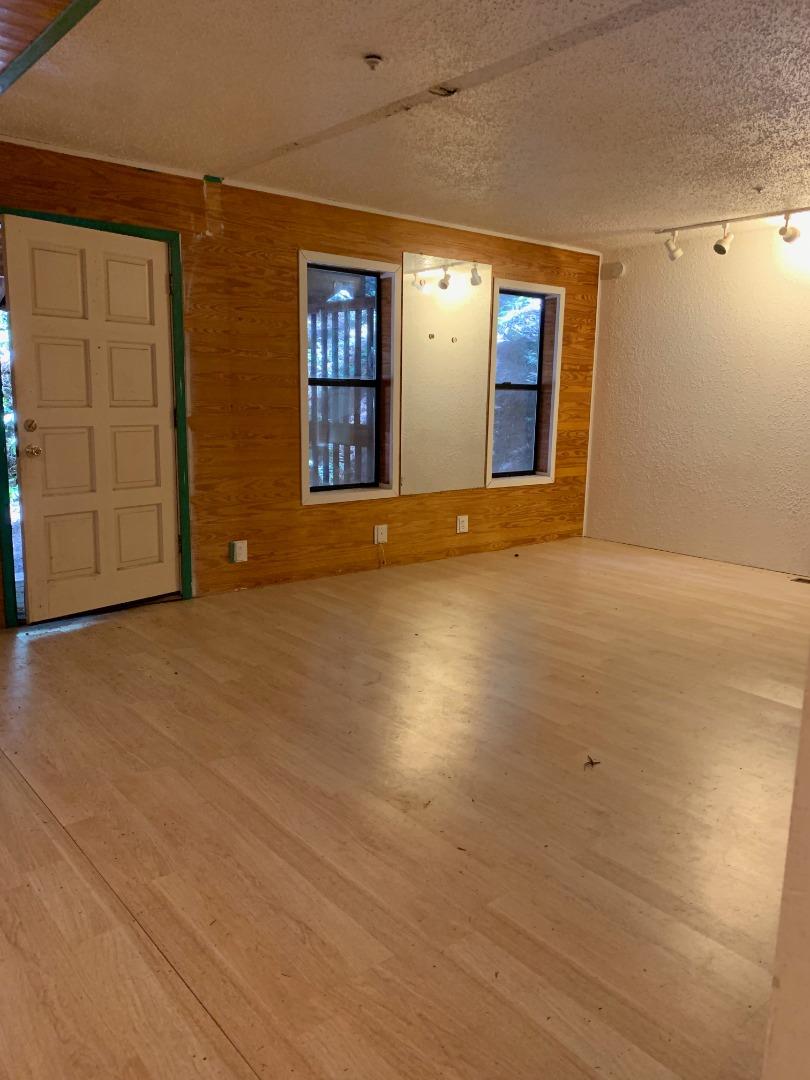 700 Laurel View Road Los Gatos, CA 95033 - Photo 5 of 15 a view of an empty room with window and wooden floor