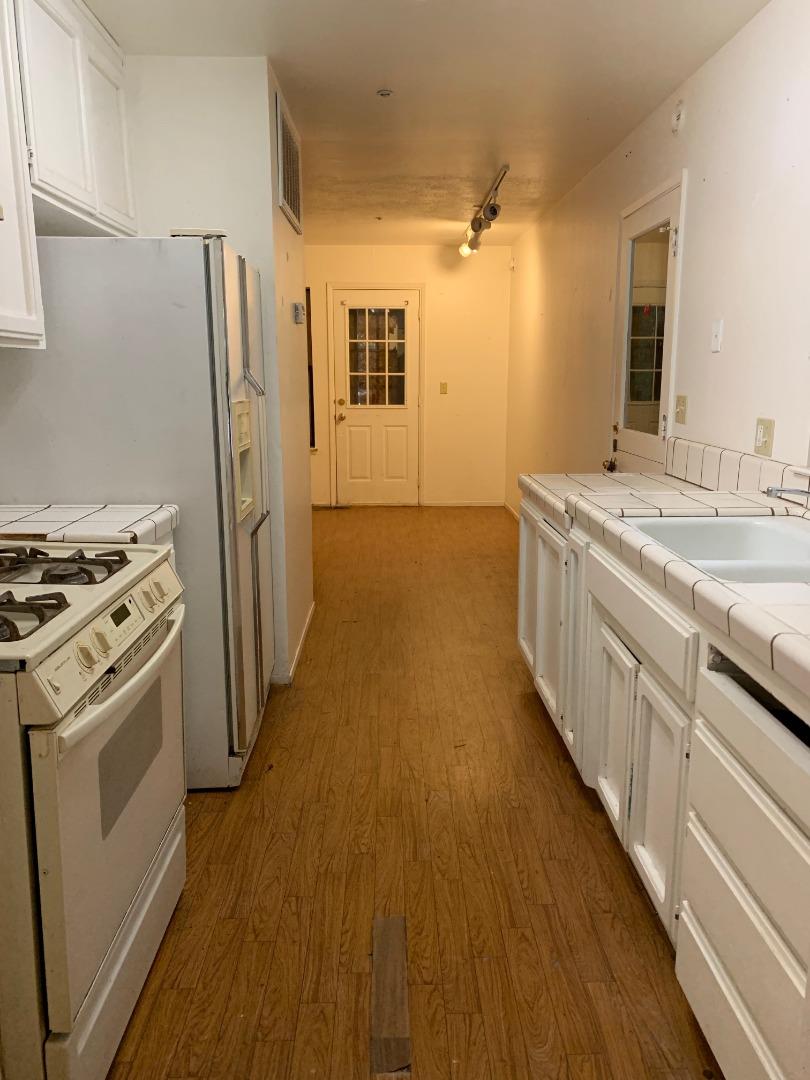 700 Laurel View Road Los Gatos, CA 95033 - Photo 7 of 15 a kitchen with stainless steel appliances a sink and a refrigerator
