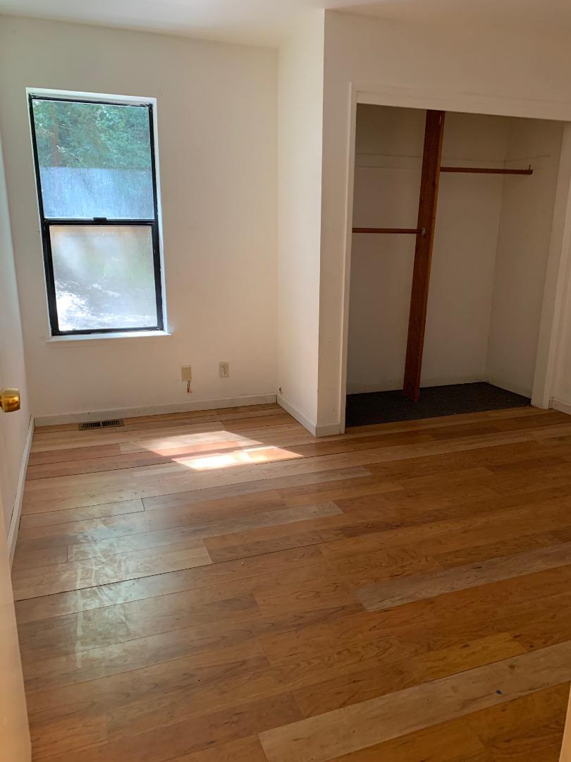 700 Laurel View Road Los Gatos, CA 95033 - Photo 9 of 15 a view of an empty room with wooden floor and a window