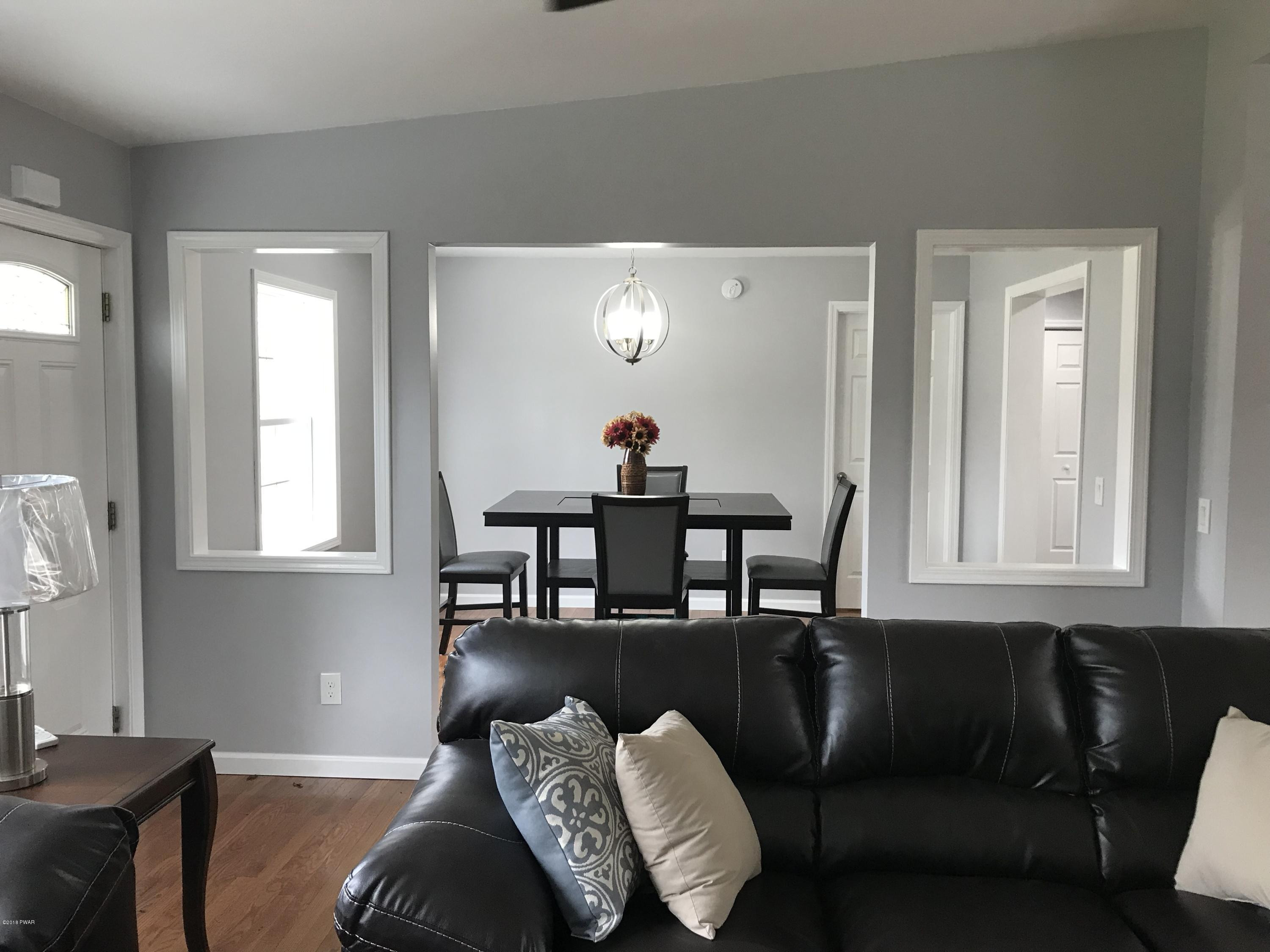 81 Callapoose Road Moscow, PA 18444 - Photo 7 of 24 Living Room to Dining Room
