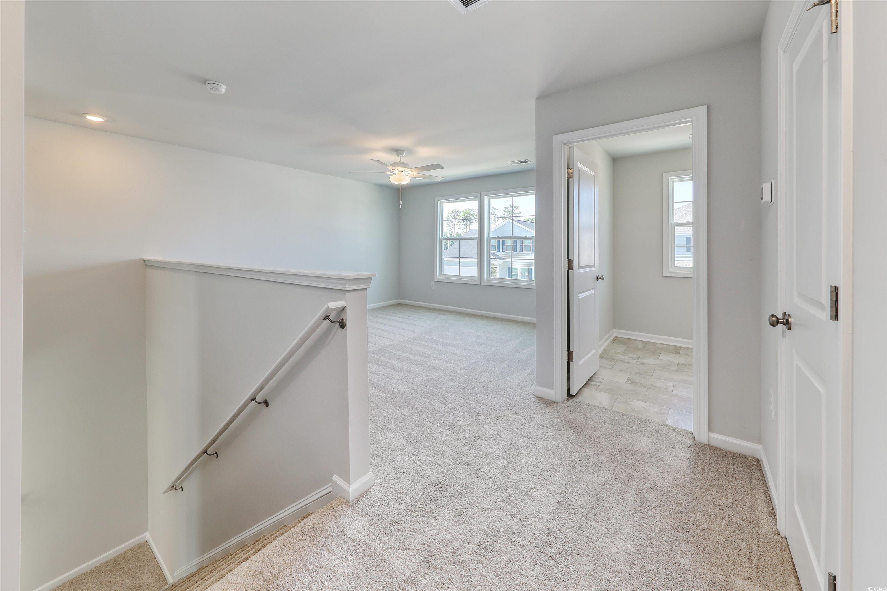 720 St Albans Loop Conway, SC 29526 - Photo 4 of 15 Hallway with light carpet