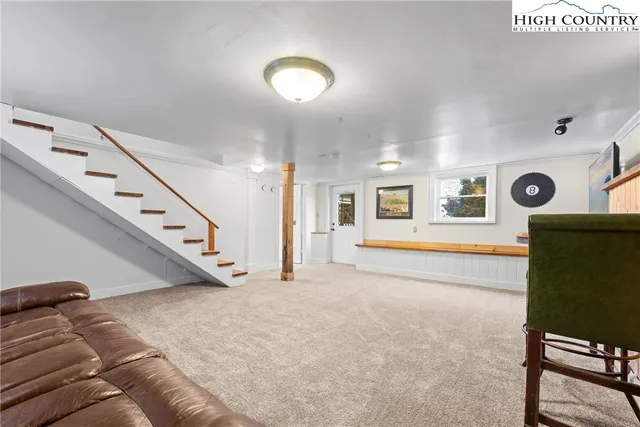 a front view of a house with sitting yard