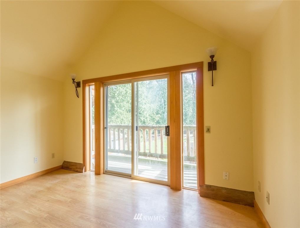1021 Kelly Road Bellingham, WA 98226 - Photo 3 of 8 a view of an empty room with wooden floor and a window