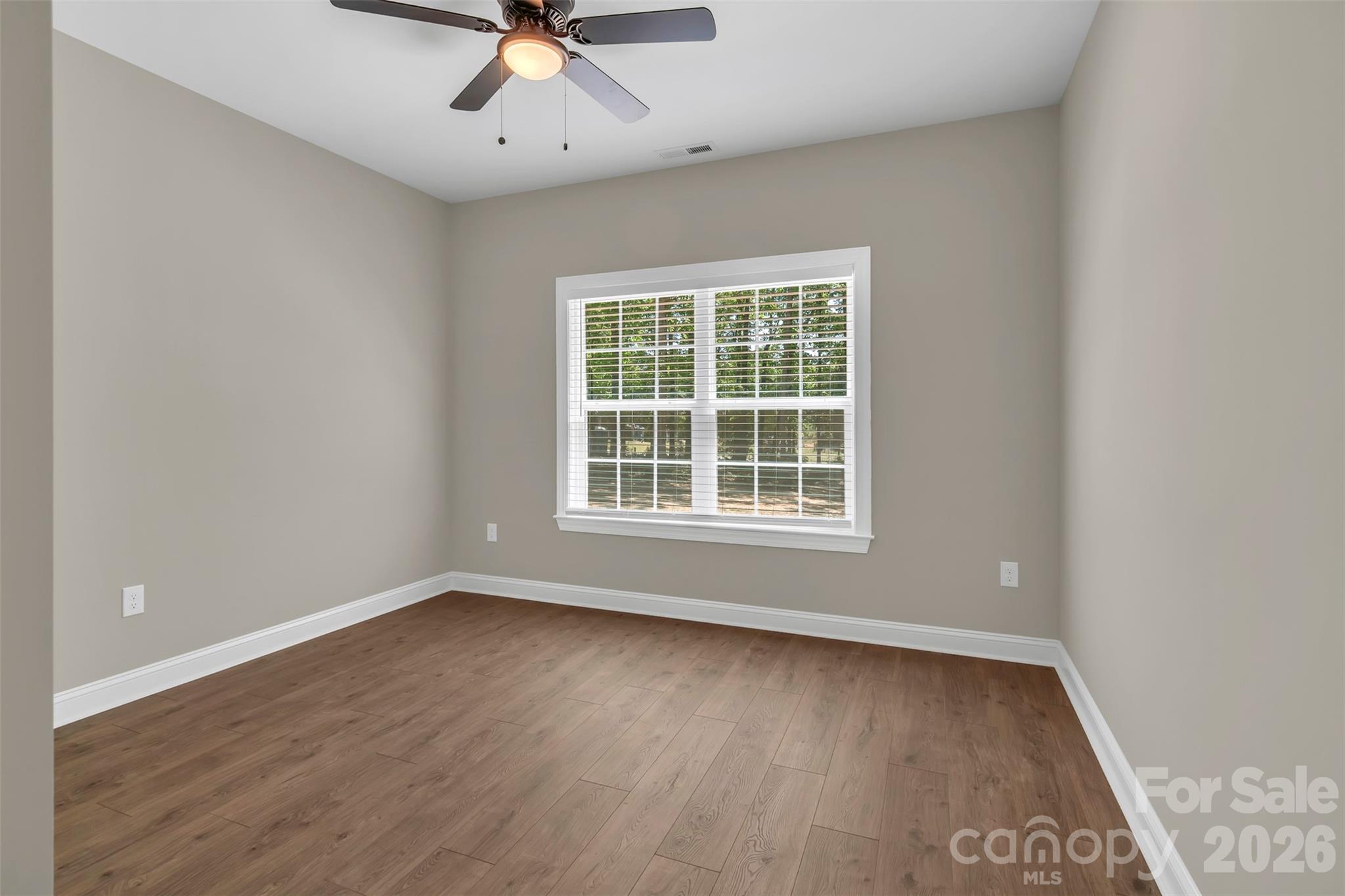 0 Cimmeron Road Lancaster, SC 29720 - Photo 24 of 29 wooden floor in an empty room with a window