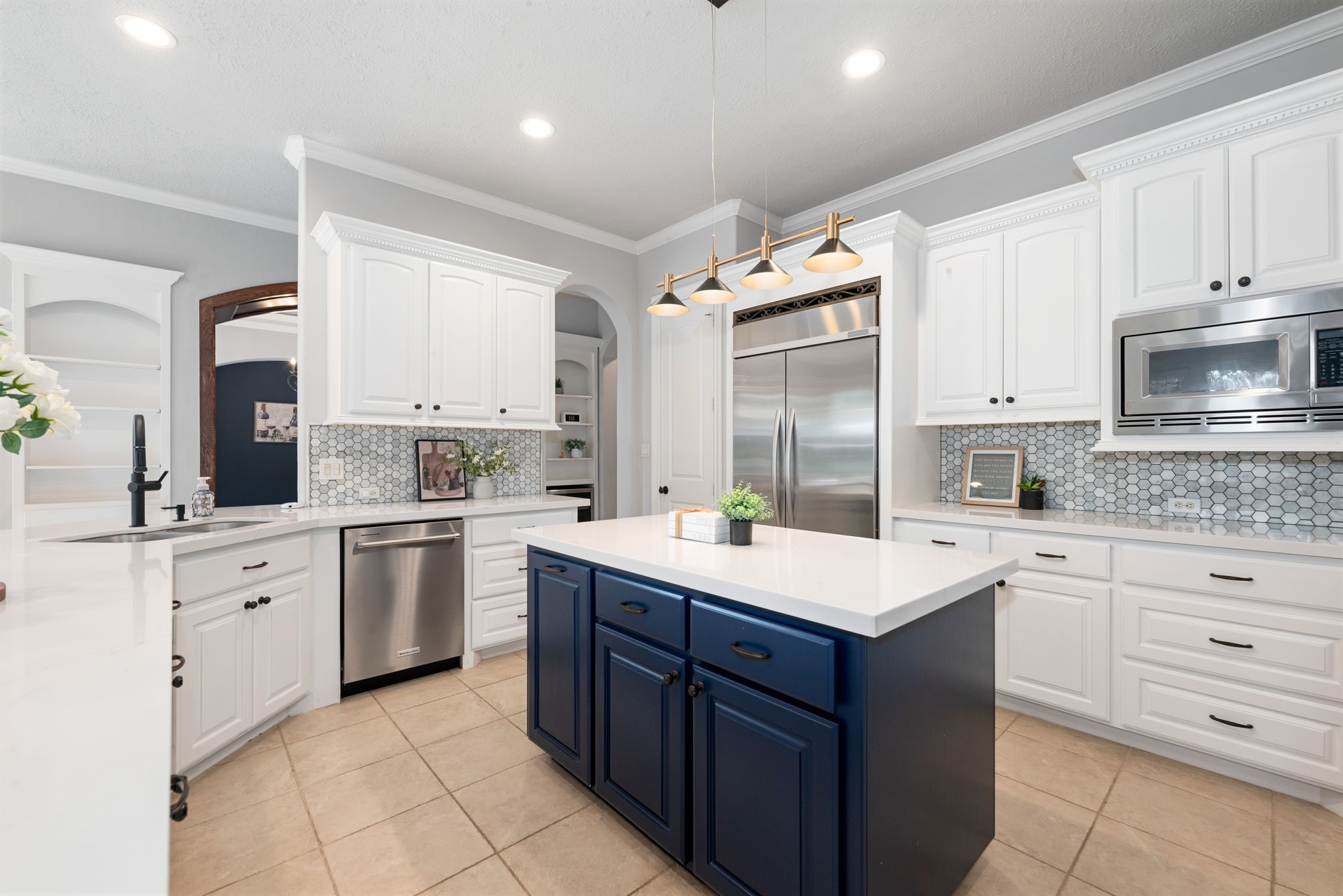 6006 Valhalla Drive Spring, TX 77379 - Photo 8 of 44 Chef’s kitchen features quartz countertops, stainless steel appliances, double ovens, pot filler, and an oversized island.
