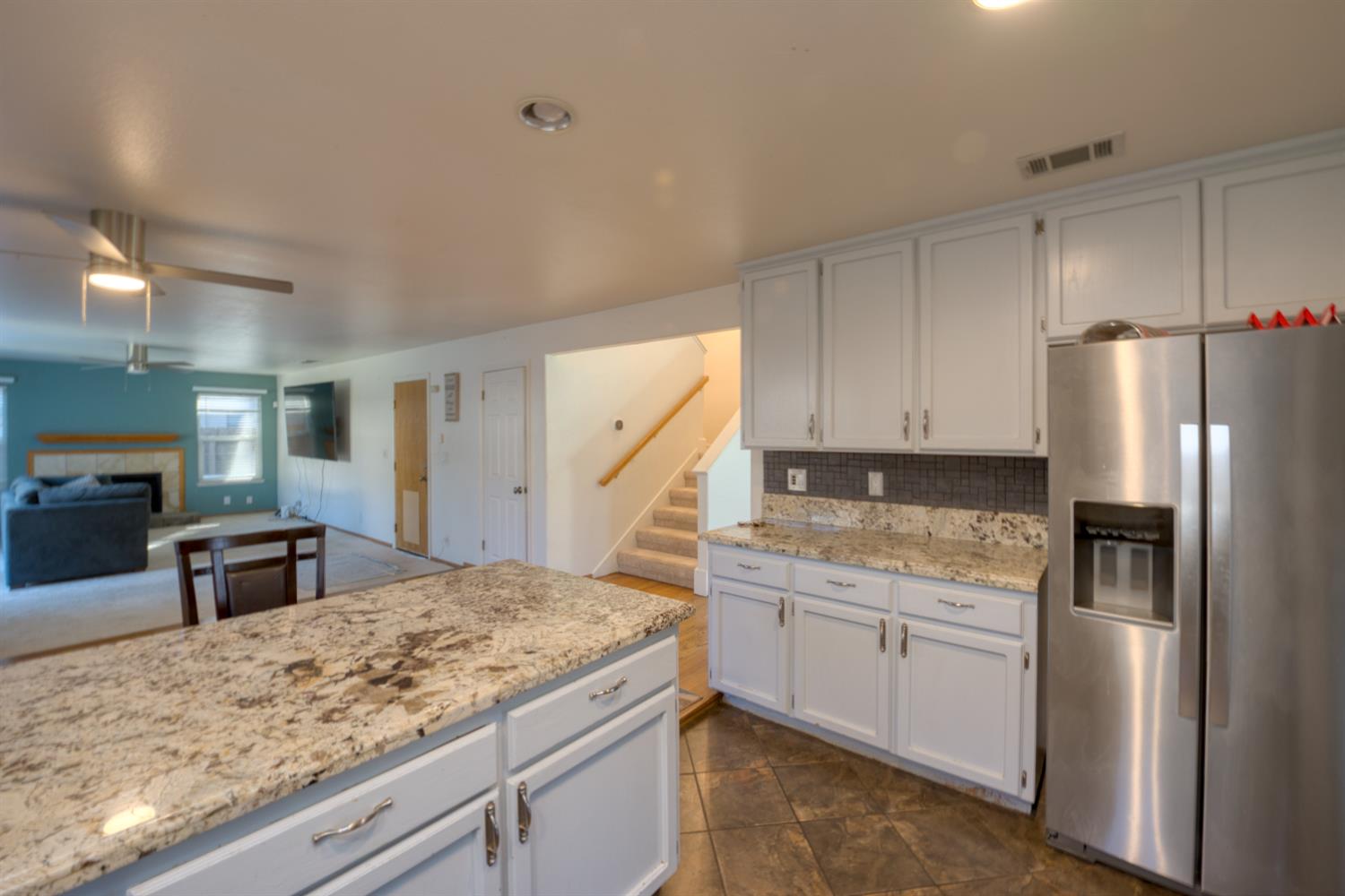 548 Hansen Court Patterson, CA 95363 - Photo 12 of 38 a kitchen with stainless steel appliances granite countertop a refrigerator sink and stove