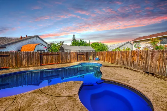 a view of a swimming pool with a patio